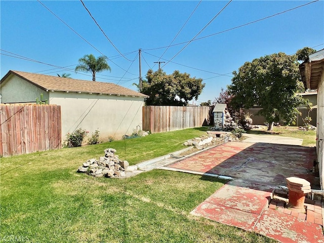 view of yard with a fenced backyard and a patio area