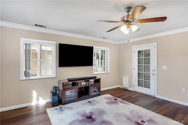 28970 Exmoor Ct, Menifee, CA 92586 - living area with baseboards, crown molding, wood finished floors, and visible vents