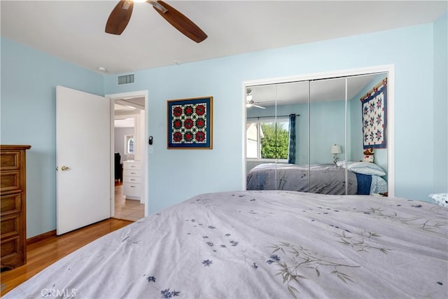 28970 Exmoor Ct, Menifee, CA 92586 - bedroom with visible vents, ceiling fan, wood finished floors, and a closet