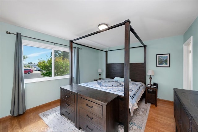 28970 Exmoor Ct, Menifee, CA 92586 - bedroom with baseboards and light wood finished floors