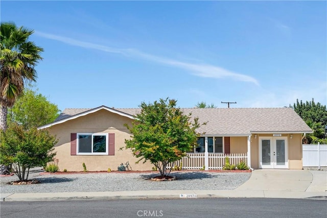 28970 Exmoor Ct, Menifee, CA 92586 - ranch-style home with french doors, stucco siding, and driveway