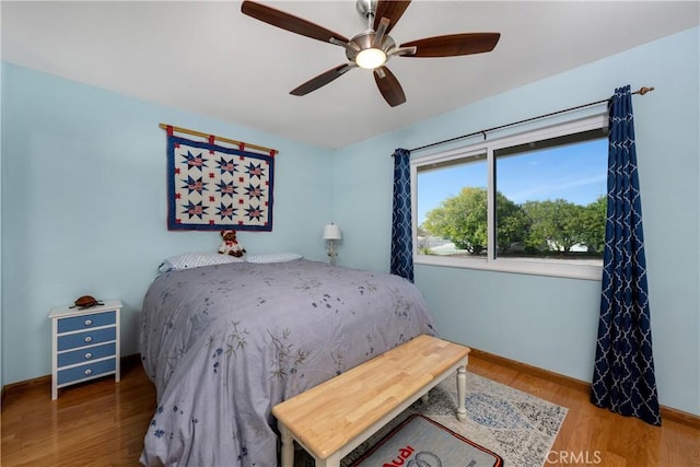 28970 Exmoor Ct, Menifee, CA 92586 - bedroom with baseboards, ceiling fan, and wood finished floors