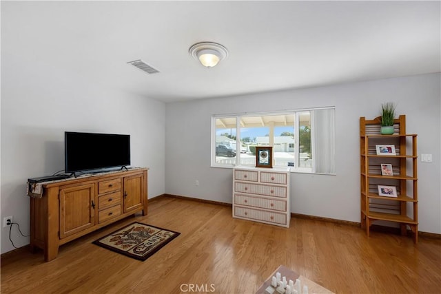 28970 Exmoor Ct, Menifee, CA 92586 - living room featuring light wood finished floors and baseboards