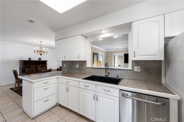 28970 Exmoor Ct, Menifee, CA 92586 - kitchen with a sink, a chandelier, tile countertops, decorative backsplash, and stainless steel dishwasher