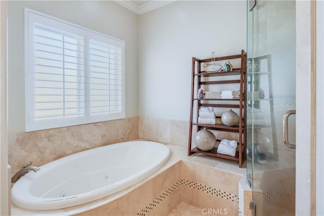 full bathroom with crown molding, a jetted tub, and a stall shower