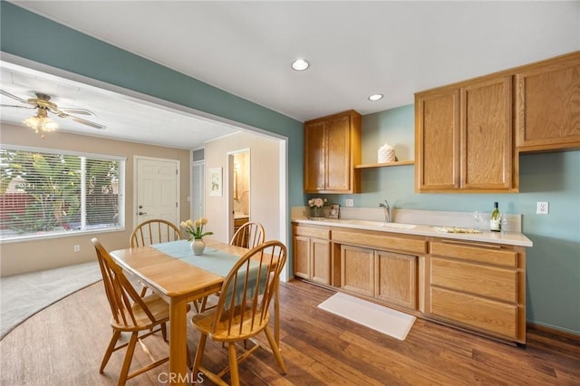 2574 W Heffron Dr, Anaheim, CA 92804 - kitchen featuring light countertops, open shelves, dark wood finished floors, and a sink