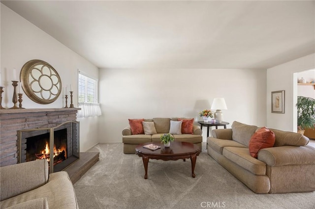 2574 W Heffron Dr, Anaheim, CA 92804 - living area featuring carpet flooring and a lit fireplace
