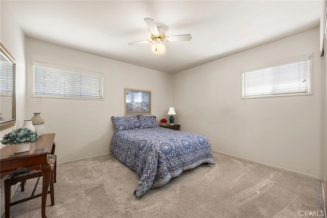 2574 W Heffron Dr, Anaheim, CA 92804 - carpeted bedroom with ceiling fan, multiple windows, and baseboards