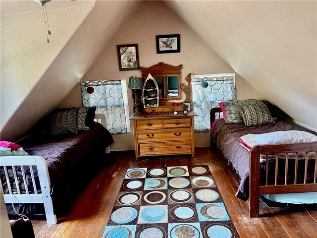 bedroom featuring vaulted ceiling and hardwood / wood-style floors