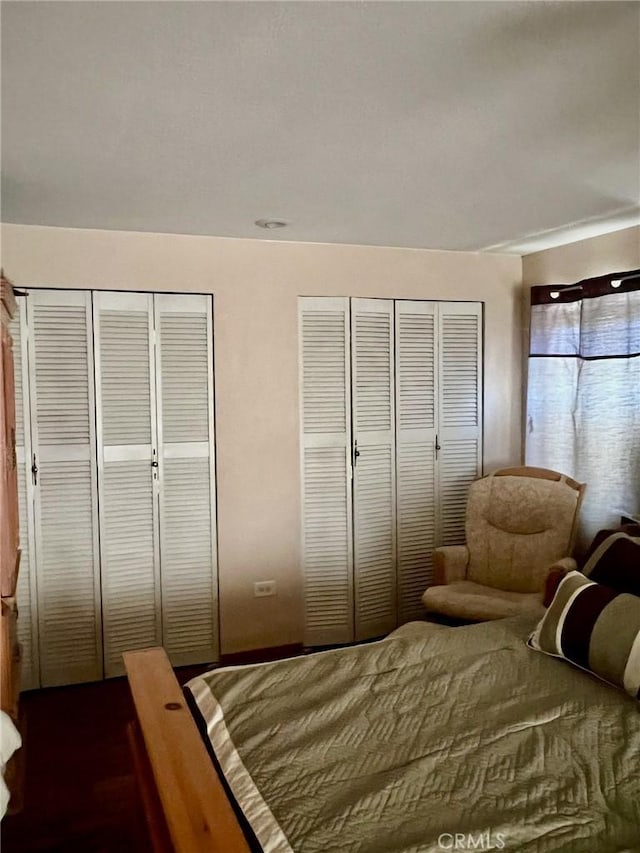 bedroom featuring two closets