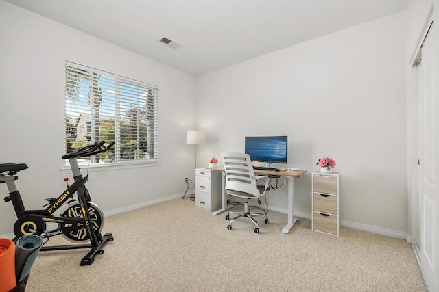 office area featuring visible vents, baseboards, and carpet floors