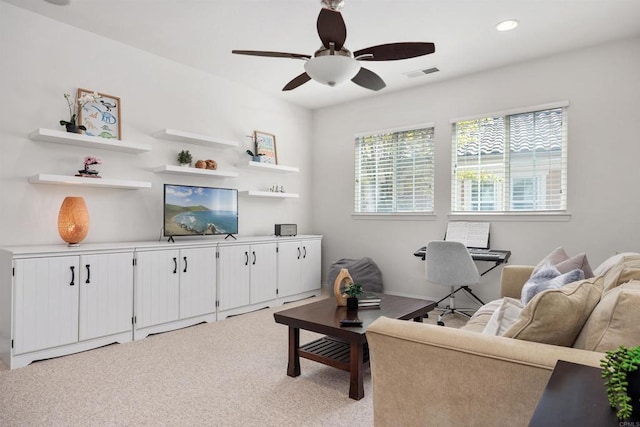 living room with a ceiling fan, light colored carpet, visible vents, and recessed lighting