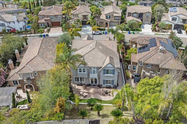 birds eye view of property with a residential view