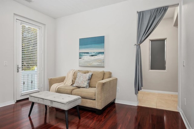 2258 Aventurine Pl, Carlsbad, CA 92009 - living room with wood finished floors, plenty of natural light, and baseboards