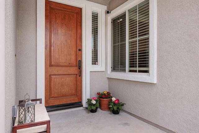 2258 Aventurine Pl, Carlsbad, CA 92009 - doorway to property featuring stucco siding and a porch