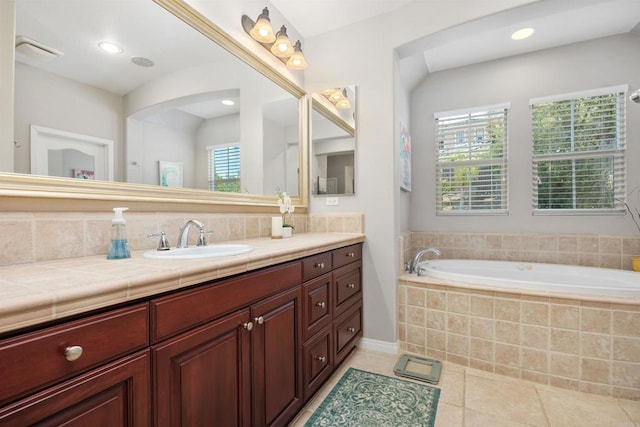 2258 Aventurine Pl, Carlsbad, CA 92009 - bathroom with tile patterned floors, a garden tub, vanity, decorative backsplash, and recessed lighting