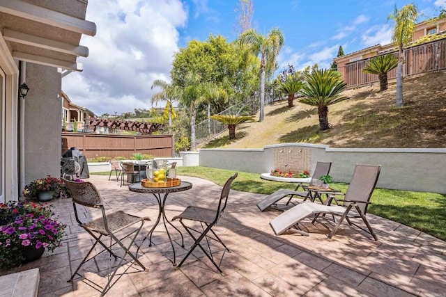 2258 Aventurine Pl, Carlsbad, CA 92009 - fenced backyard featuring a patio area and outdoor dining space