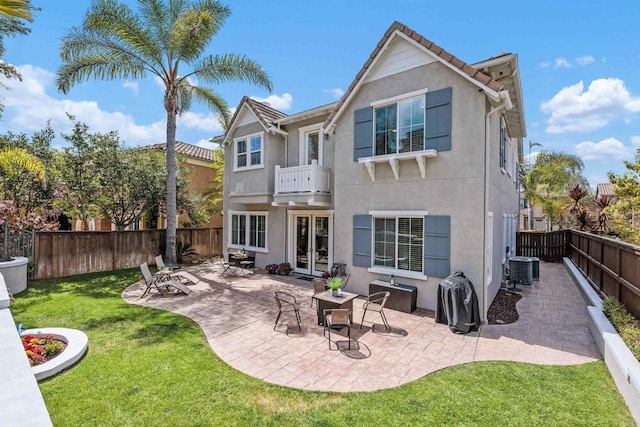 2258 Aventurine Pl, Carlsbad, CA 92009 - back of property featuring french doors, a balcony, stucco siding, a patio area, and central air condition unit