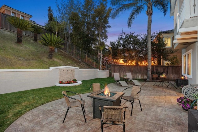 2258 Aventurine Pl, Carlsbad, CA 92009 - patio terrace at dusk featuring an outdoor fire pit and a patio