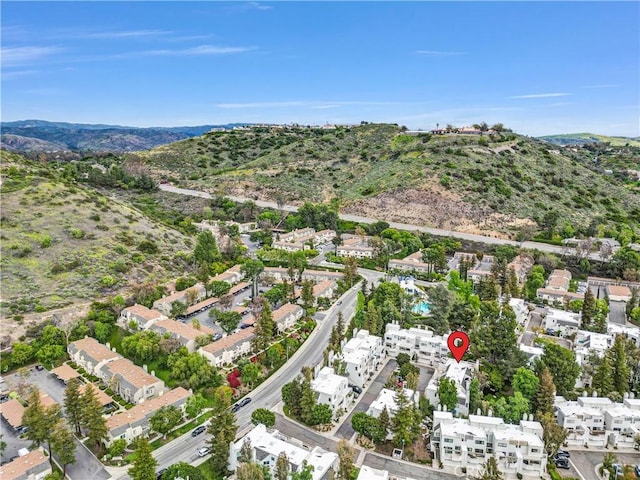 birds eye view of property with a residential view and a mountain view