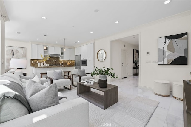 living area with recessed lighting, marble finish floor, crown molding, and visible vents