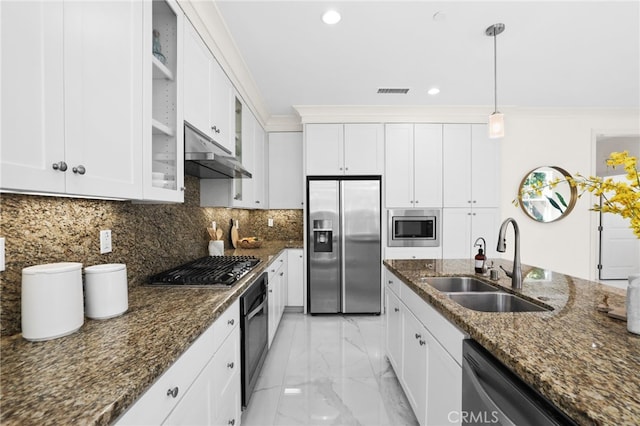 kitchen with marble finish floor, under cabinet range hood, white cabinets, a sink, and appliances with stainless steel finishes
