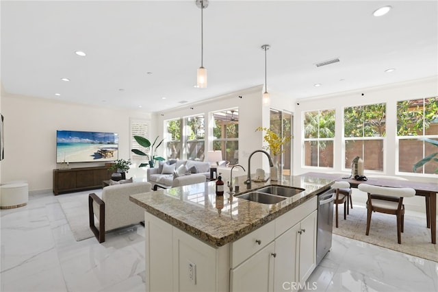 kitchen featuring a sink, dishwasher, an island with sink, marble finish floor, and visible vents