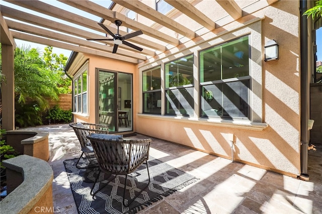 view of patio / terrace with a pergola, ceiling fan, and fence