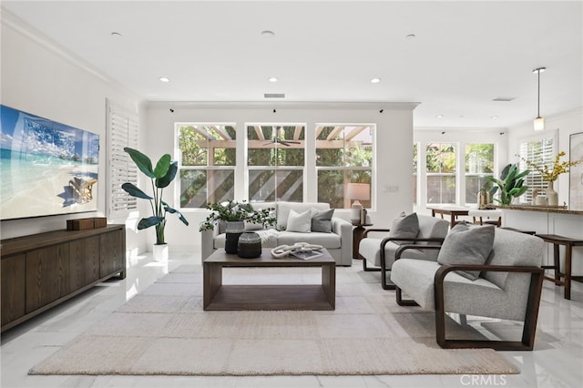 living area with baseboards, ceiling fan, recessed lighting, and visible vents