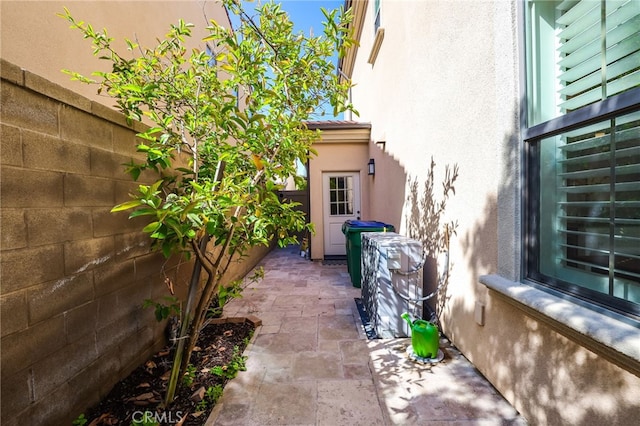 view of home's exterior with a patio and stucco siding