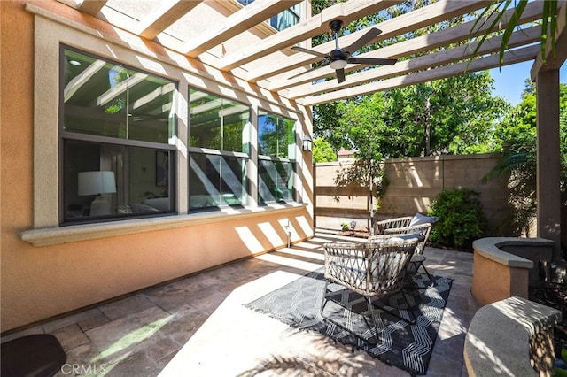 view of patio / terrace featuring a ceiling fan, fence, and a pergola