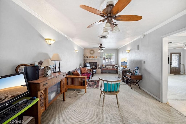carpeted living area featuring crown molding, a ceiling fan, and visible vents