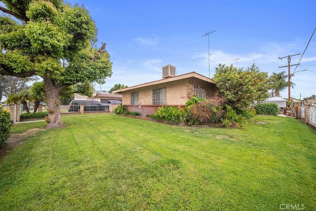 view of yard with fence