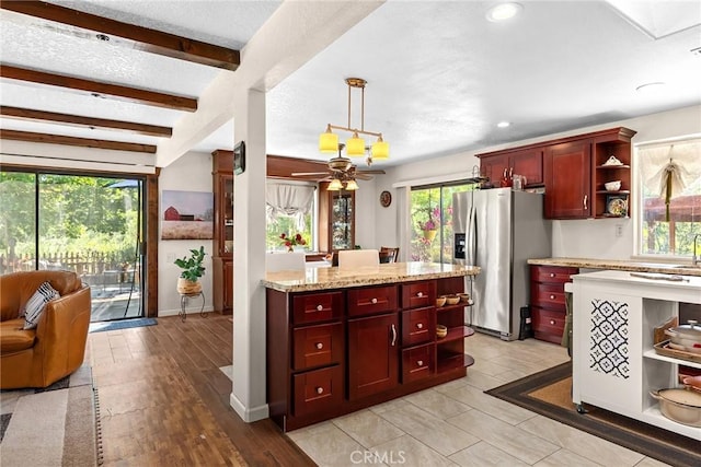 26231 Wilson St, Los Molinos, CA 96055 - kitchen featuring stainless steel fridge, plenty of natural light, open shelves, and dark brown cabinets