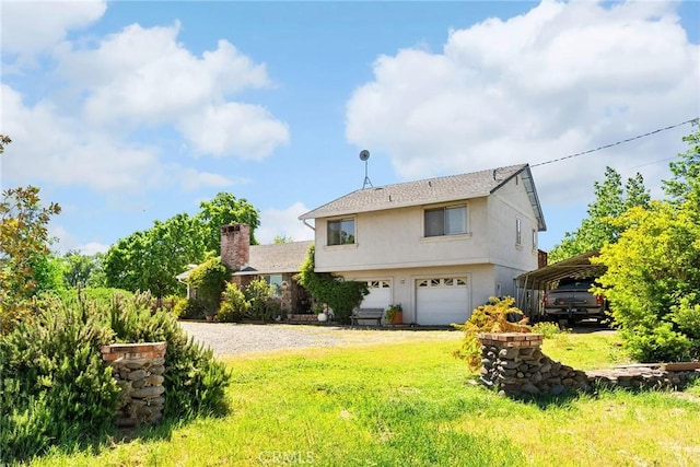 26231 Wilson St, Los Molinos, CA 96055 - exterior space with a front lawn, a detached carport, stucco siding, a chimney, and driveway