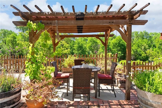 26231 Wilson St, Los Molinos, CA 96055 - view of patio with fence, outdoor dining space, and a pergola