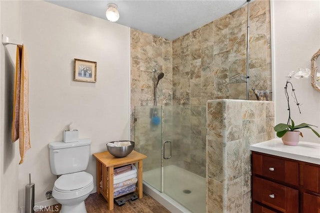 26231 Wilson St, Los Molinos, CA 96055 - full bathroom with vanity, a shower stall, toilet, and wood finished floors