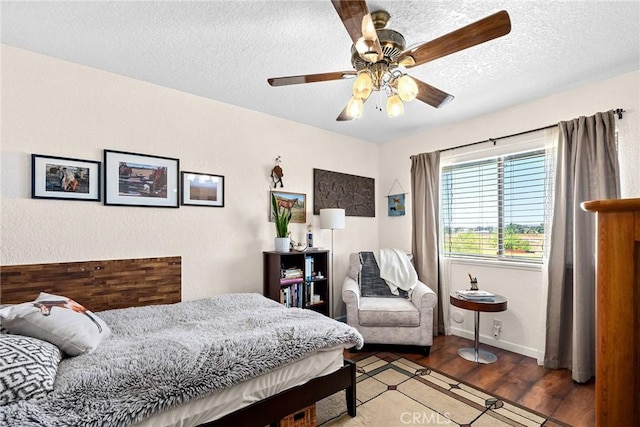 26231 Wilson St, Los Molinos, CA 96055 - bedroom featuring baseboards, a textured ceiling, ceiling fan, and wood finished floors