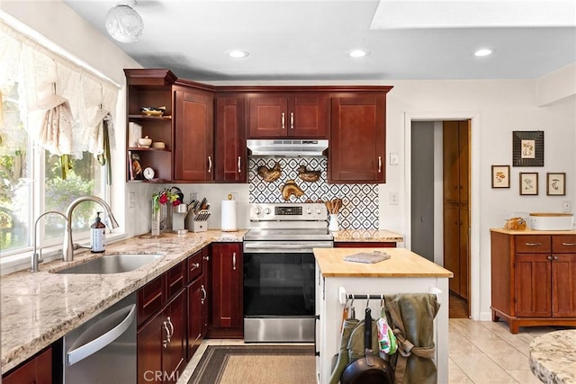 26231 Wilson St, Los Molinos, CA 96055 - kitchen with tasteful backsplash, open shelves, a sink, under cabinet range hood, and stainless steel appliances