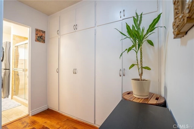 closet featuring stacked washer and dryer