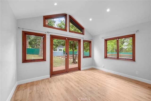 doorway featuring recessed lighting, baseboards, wood finished floors, and lofted ceiling