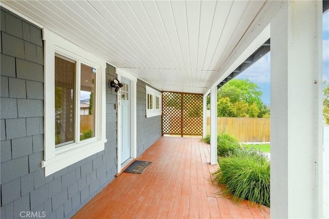 wooden terrace featuring covered porch