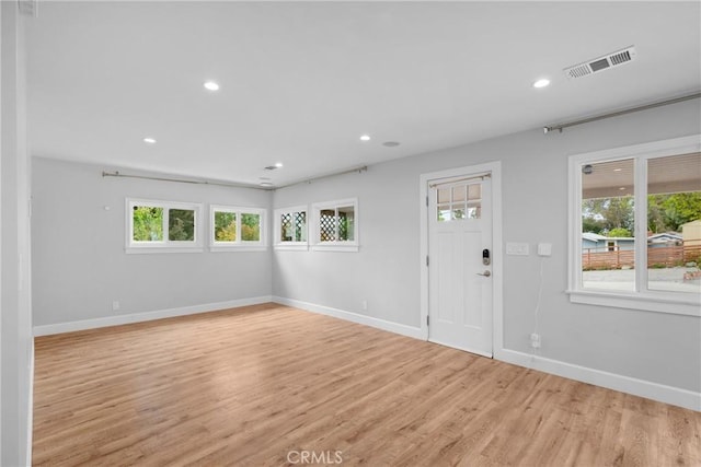 interior space with recessed lighting, visible vents, a wealth of natural light, and light wood-style floors