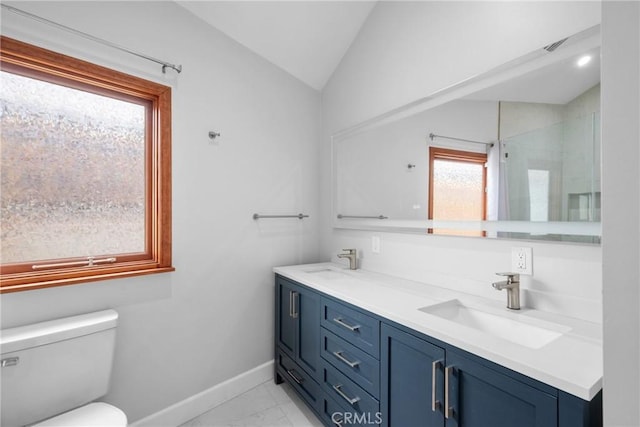bathroom featuring baseboards, a sink, marble finish floor, and lofted ceiling