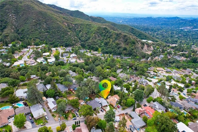 drone / aerial view with a residential view and a mountain view