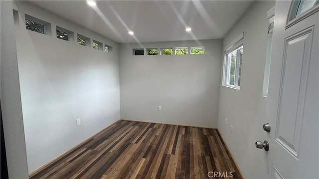 empty room with wood finished floors