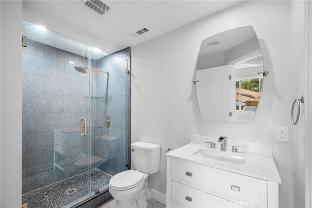full bath with visible vents, a shower stall, toilet, and vanity