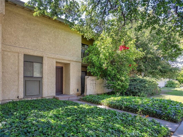 doorway to property with stucco siding