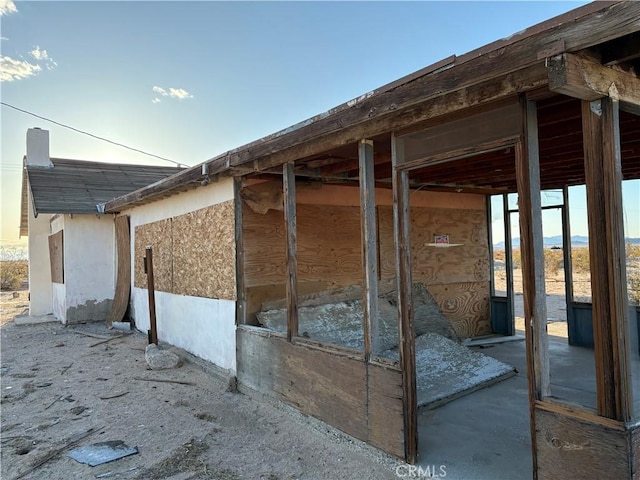 view of side of property featuring stucco siding