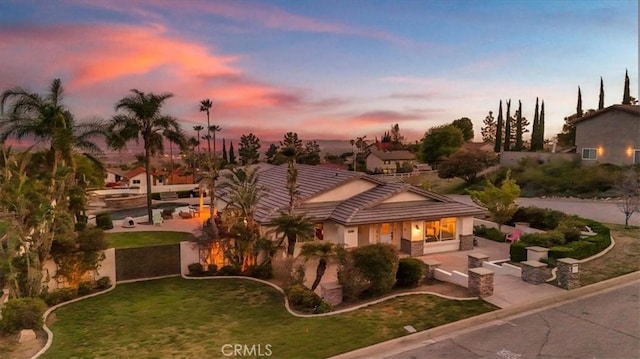 9179 Hidden Farm Rd, Rancho Cucamonga, CA 91737 - mediterranean / spanish home with a tiled roof, a front yard, and stucco siding